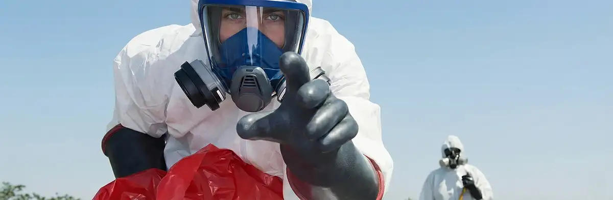 sewage clean up technician wearing protective gear handling biohazard materials in Bradenton, FL